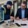 Glazing contractor reviewing fire-rated glazing systems with glass, frame, and door hardware details.
